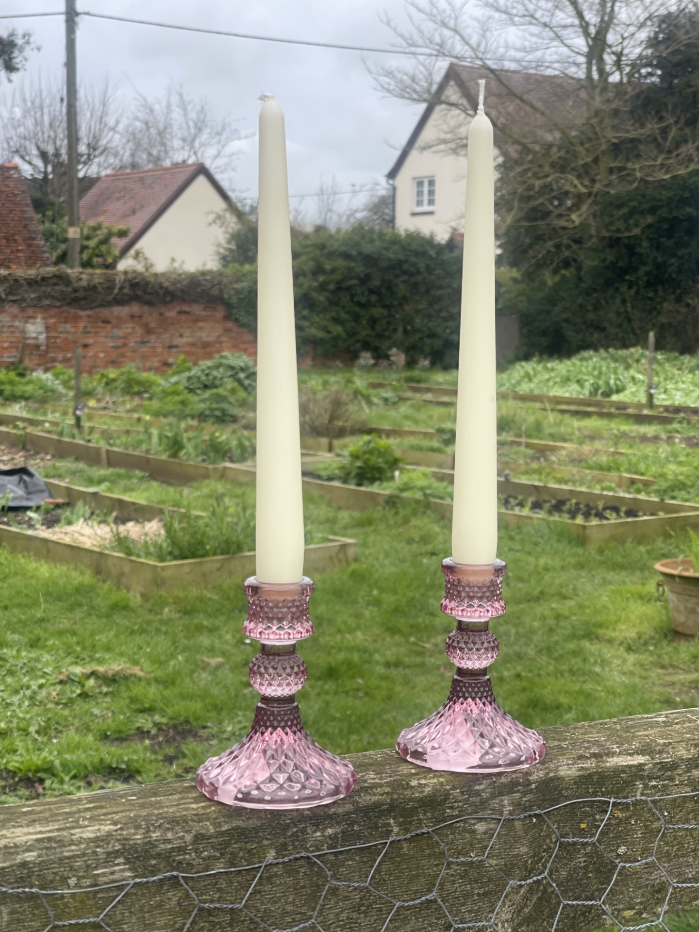 Pink glass candle stick holders
